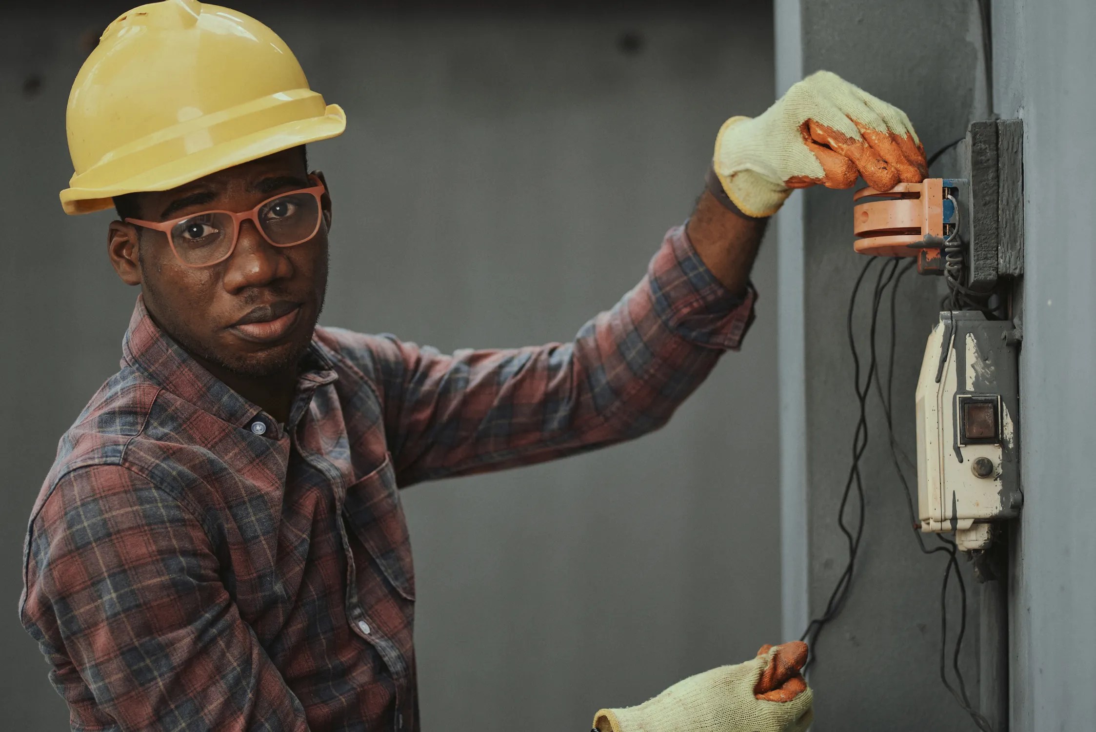 Electrician troubleshooting an electrical connection